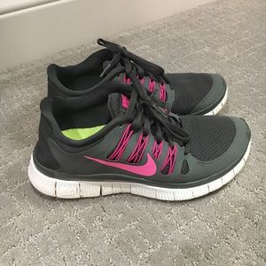 Grey and pink Nike free run 5.0